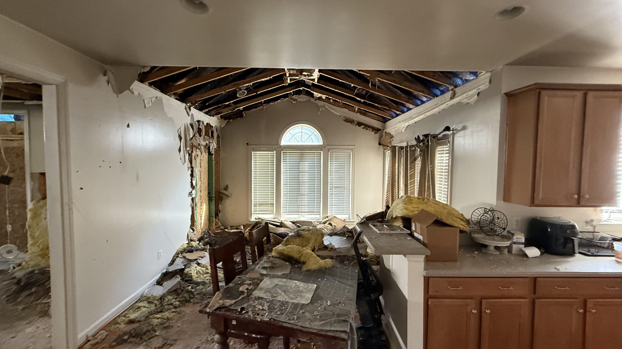 Fire damage restoration in Woodbridge, Virginia, showing demolition before reconstruction by One Vision Contracting.
